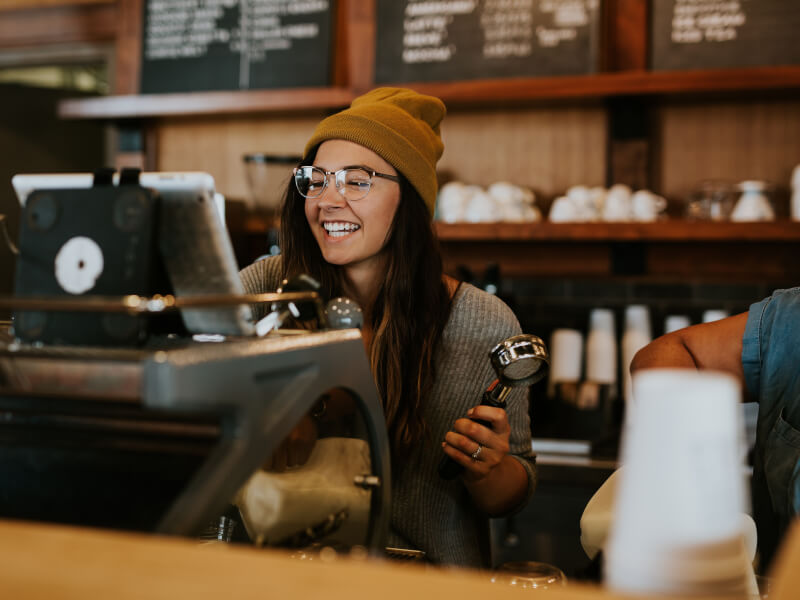 woman smiling at barista course